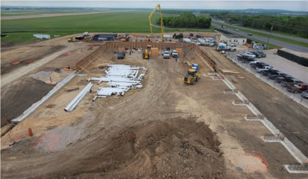 High view of dirt in area being cleared to place the fuel tanks containment system. 